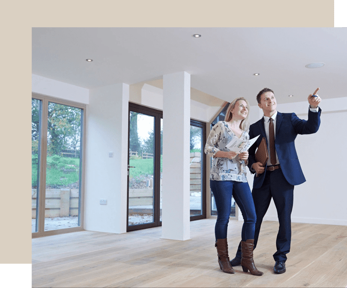 Real estate agent showing property to clients